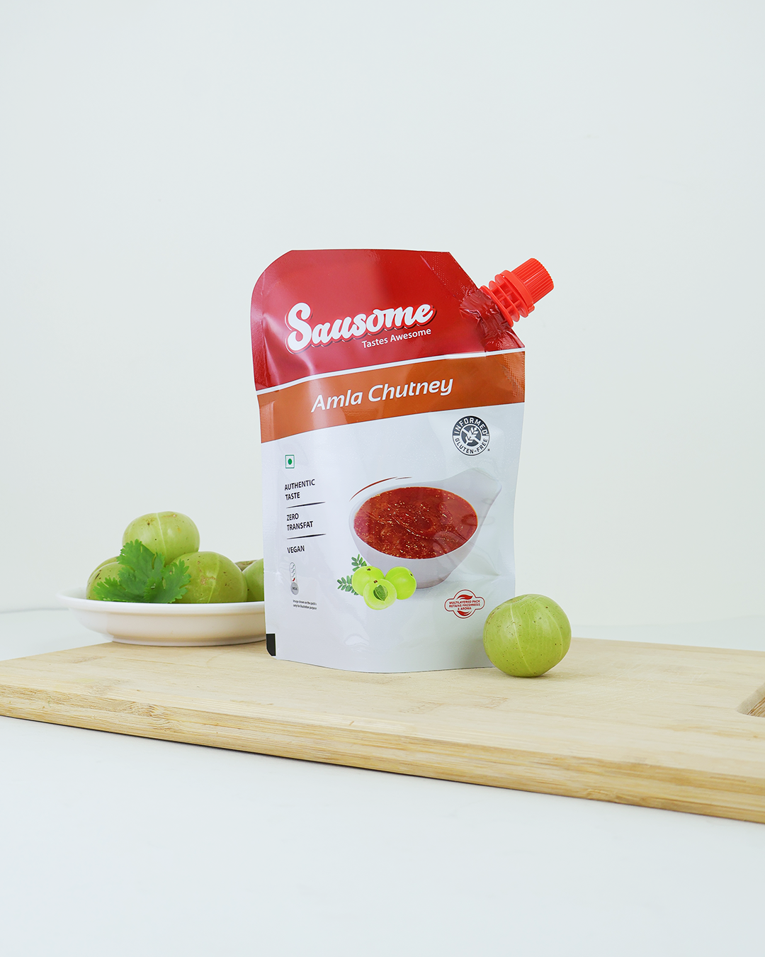 Sausome Amla Chutney packaging on a white background with Amla.
