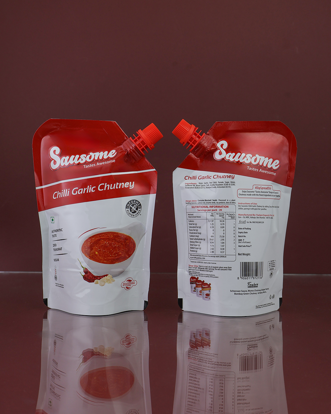 Two packages( Front & Back )of Sausome Chilli Garlic Chutney on a reflective surface with a dark background