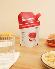 Sausome Chilli Garlic Chutney packet on a table with food items.