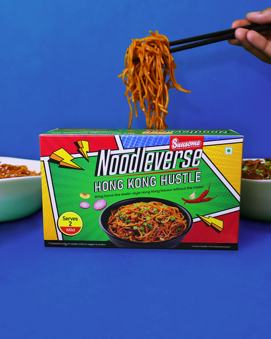 Noodleverse Hong Kong Hustle noodle box with a hand holding noodles above it on a blue background