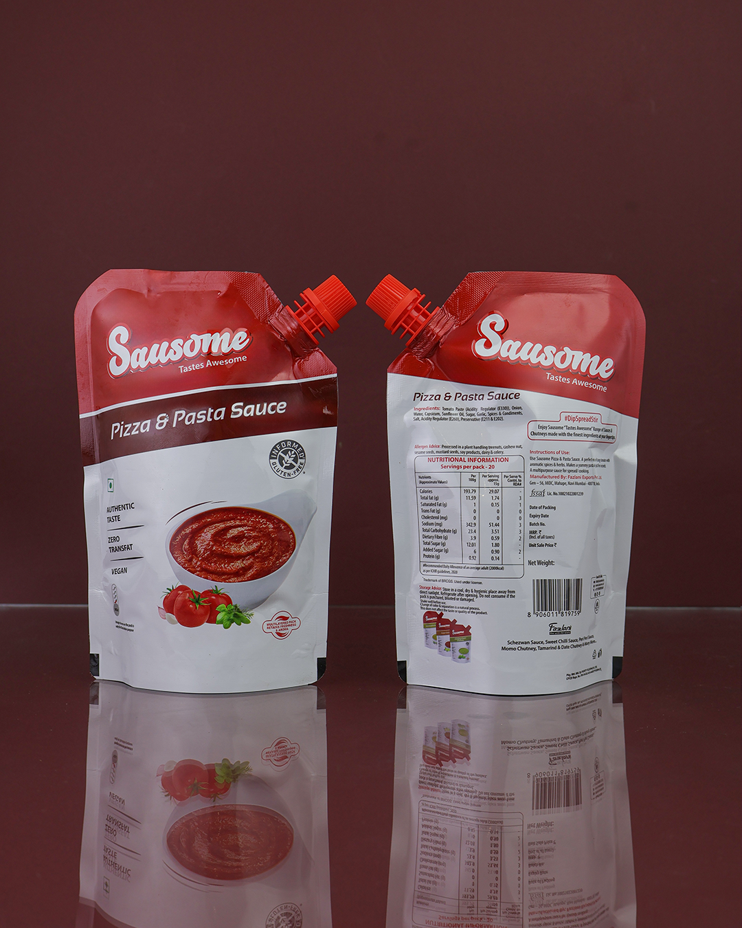 Two Sausome pizza and pasta sauce packages on a reflective surface with a red background.