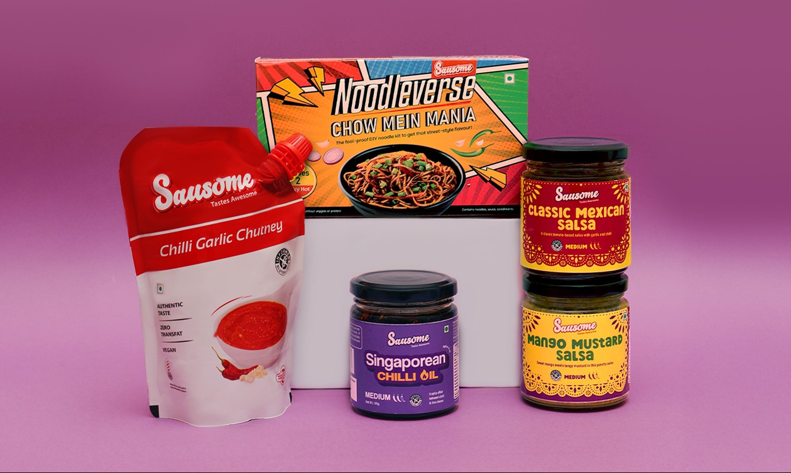 Sausome’s range of sauces and noodles including chilli garlic chutney, chilli oil, salsas, and chow mein noodles displayed on a purple backdrop.