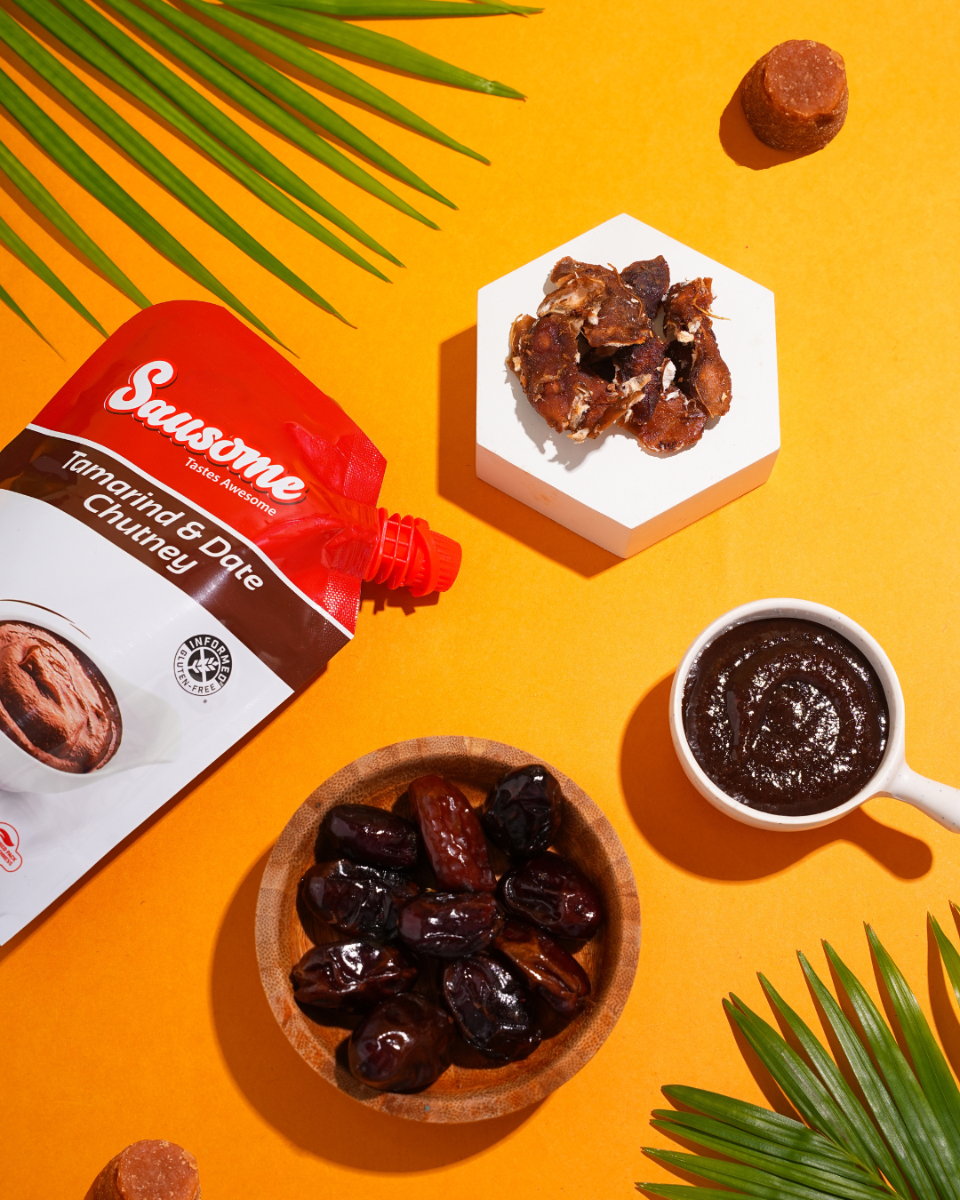 Swsome Tamarind & Date Chutney with dates on an orange background